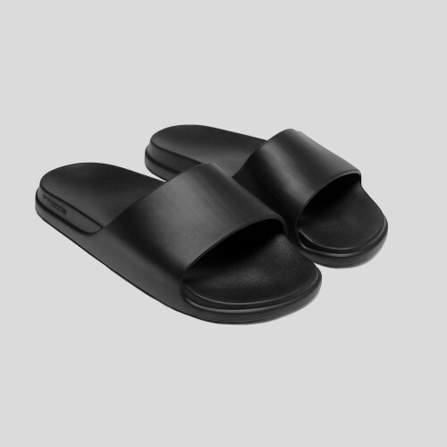 Present the Staple Slides in Black - a timeless and stylish gift for someone who enjoys versatile and comfortable footwear.
